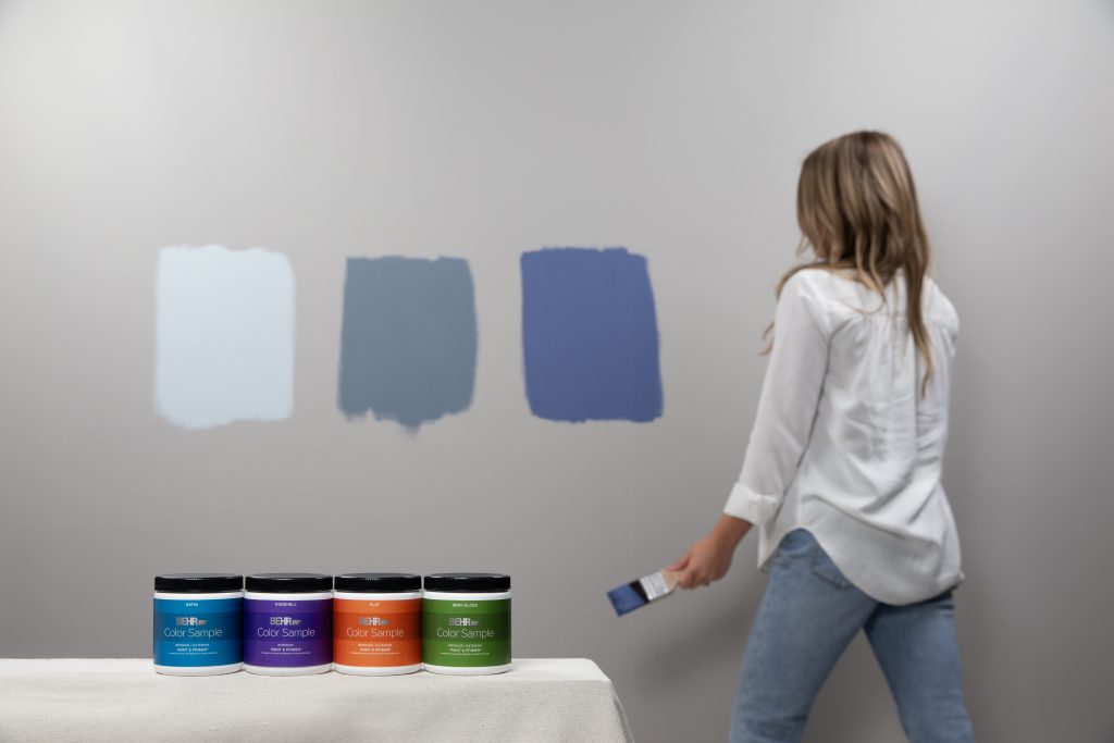 Paint color samples being tested on a wall